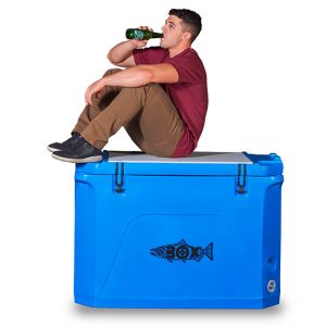 Man drinking and sitting on blue Fishbox.