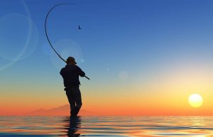 Fishing alone at sunset